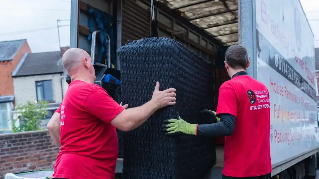 Bradway Premier Removals crew loading furniture into a lorry, with removal costs around Sheffield priced by distance