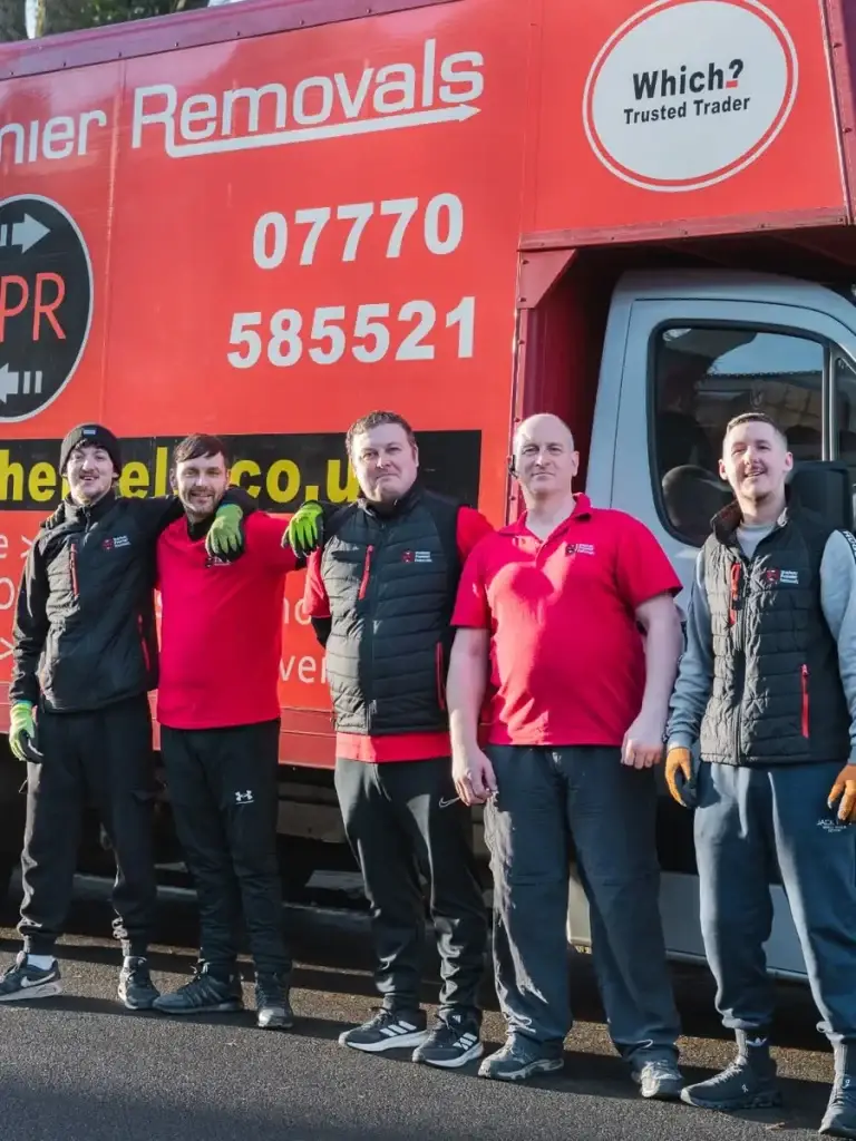 Bradway Premier Removals crew standing together in front of the red removals lorry