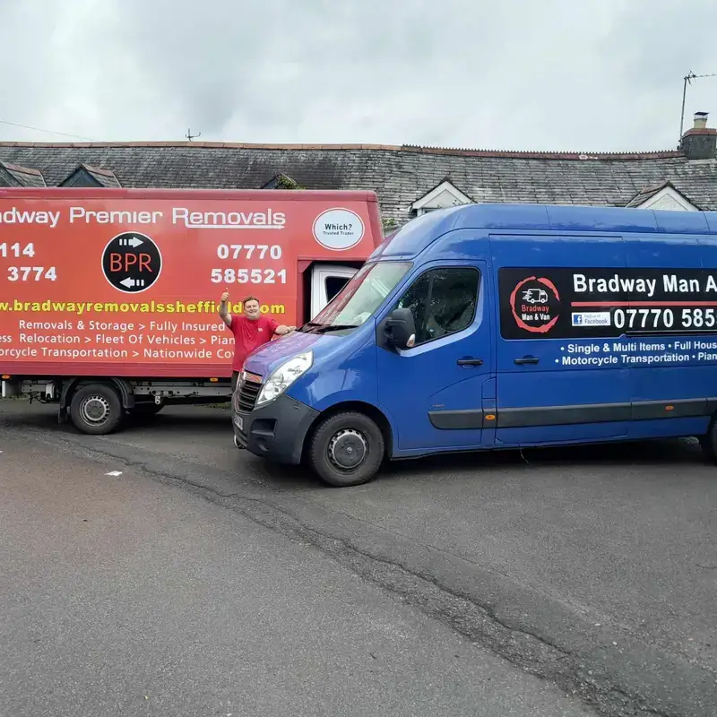 Bradway Premier Removals removals lorry and a blue removals van parked on a country lane